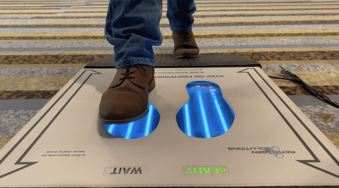 UVZone® Shoe Sanitizers being used to clean 99.9% of bacteria from the bottom of man's shoes