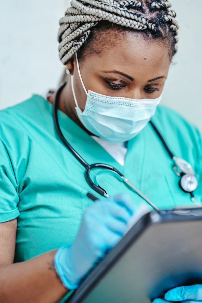 A medical professional in uniform, a frequent user of the PathO₃Gen Solutions shoe sanitizer to maintain cleanliness and hygiene in healthcare settings.